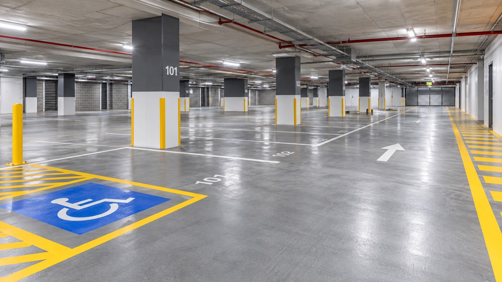 Apartment basement car park with fresh white bay line marking