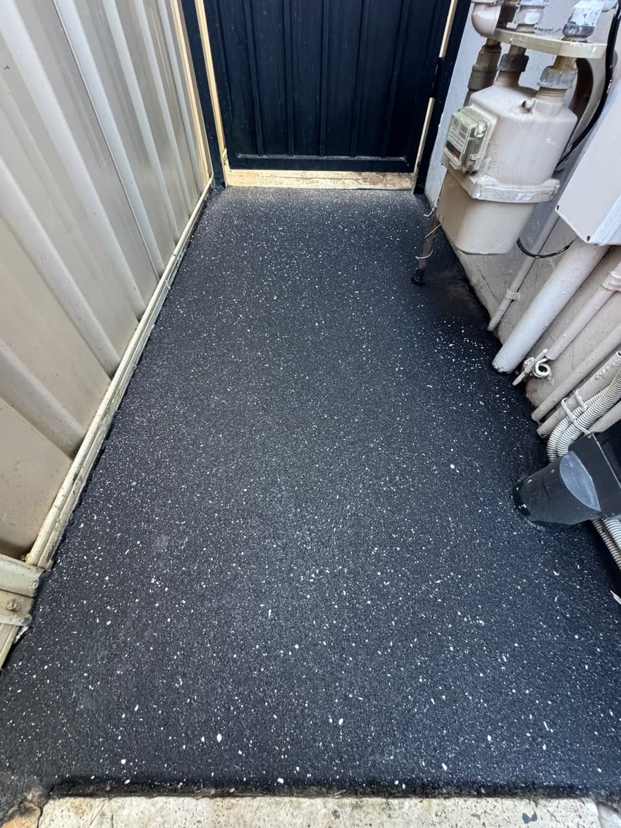 Charcoal spray-crete side path by Epoxy Flooring NSW